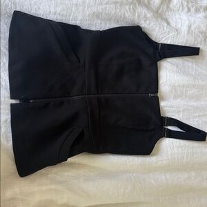 vintage top with silver zip down the middle and open back